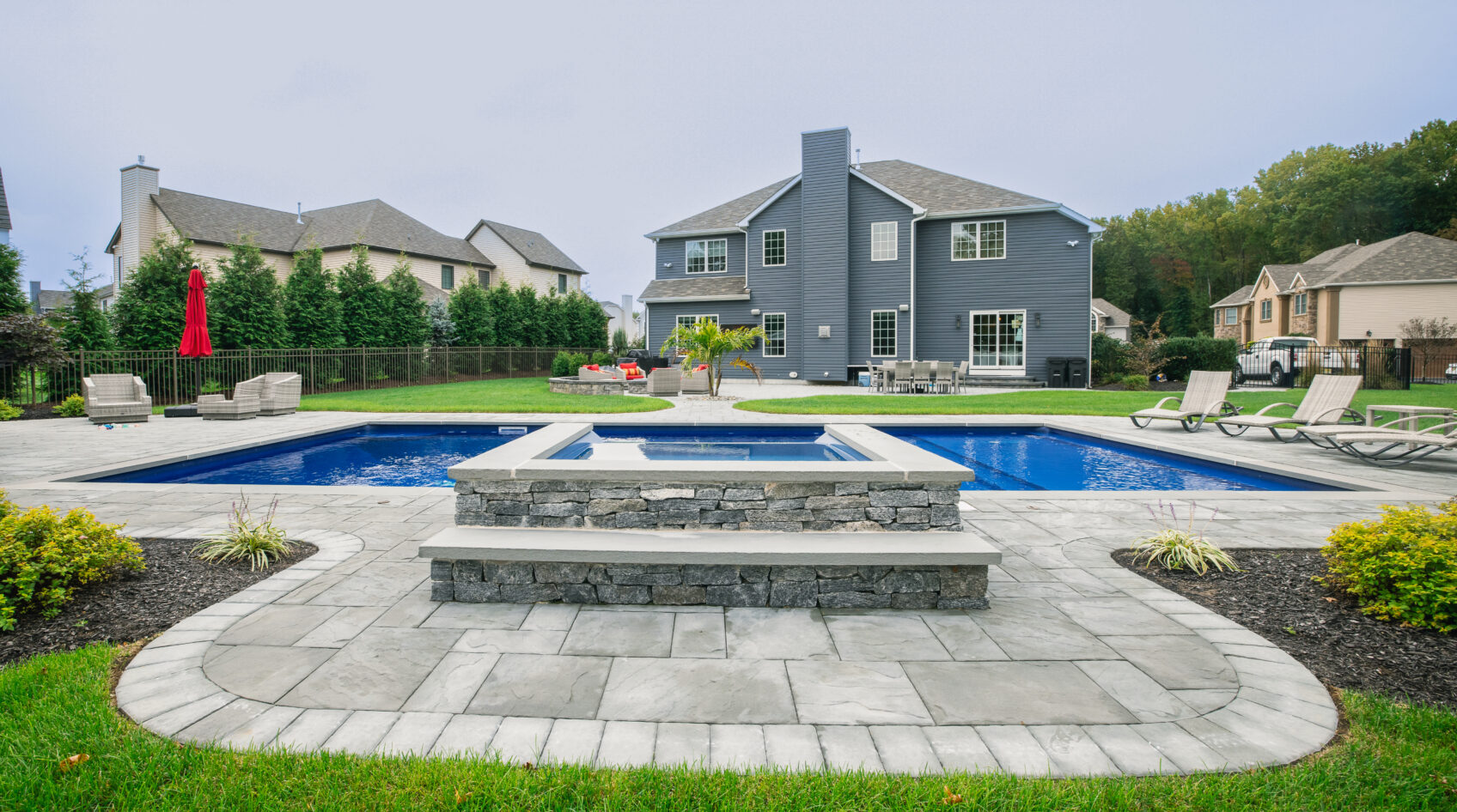 Pool coping around beautiful backyard built in pool