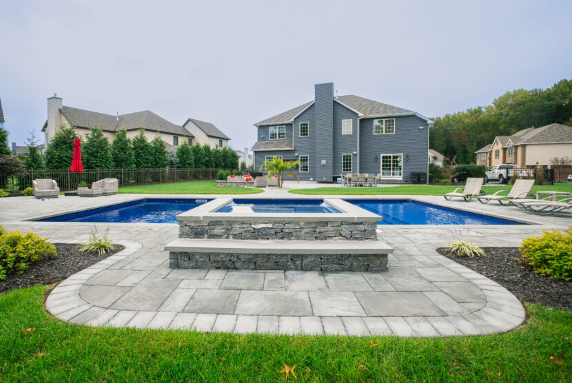 Pool coping around beautiful backyard built in pool