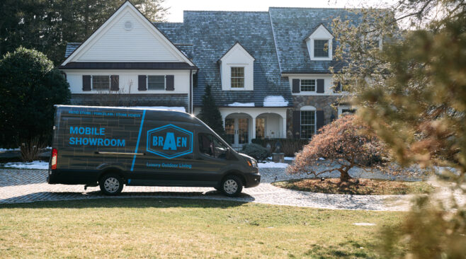 Mobile showroom for stone parked in front of a customer's home