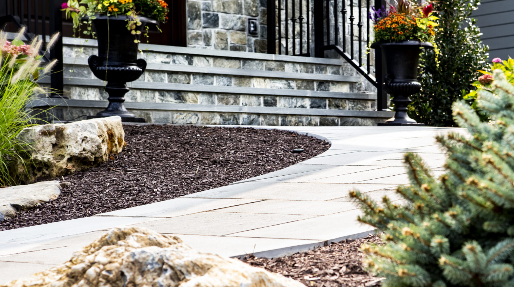 Porcelain pavers are used for this home's front walkway.