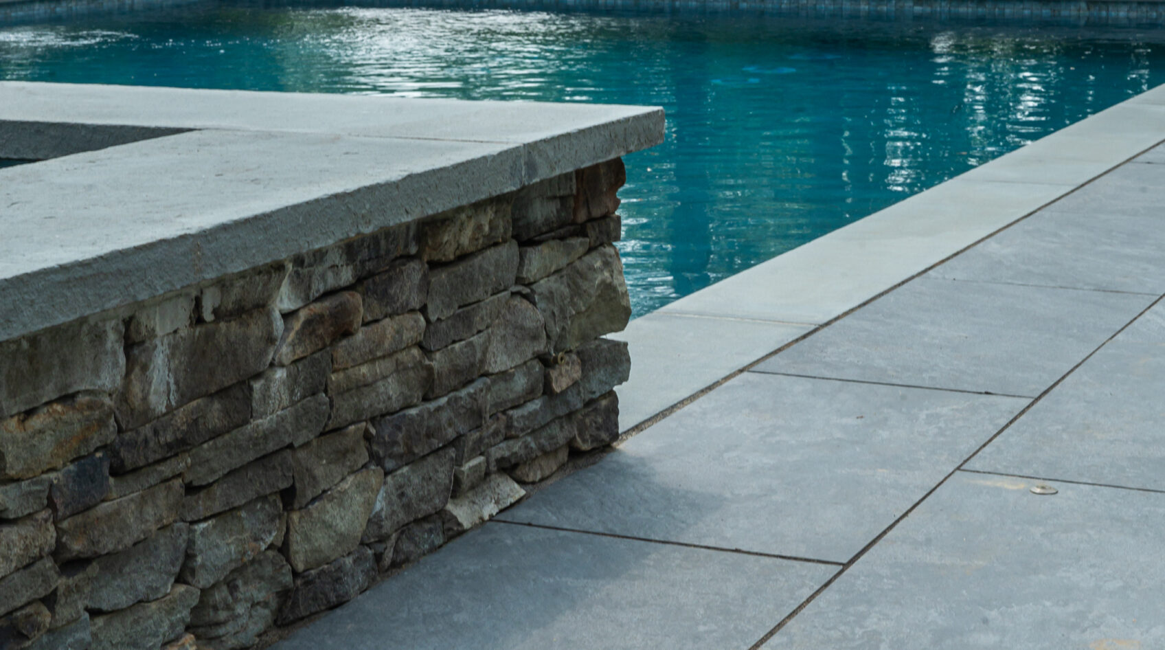 pool coping with porcelain patio